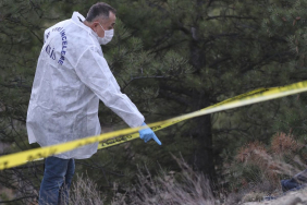 Annenin cesedi toprağa gömülü, oğlu da silahla vurulmuş halde bulundu